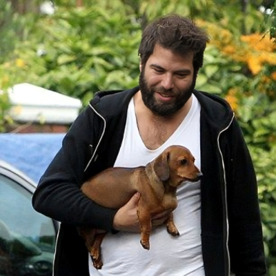 Simon Konecki a charity entrepreneur and philanthropist spotted holding a dog in London.